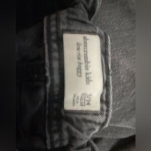 Abercrombie kids black baggy jeans, white jeans with white palm trees.